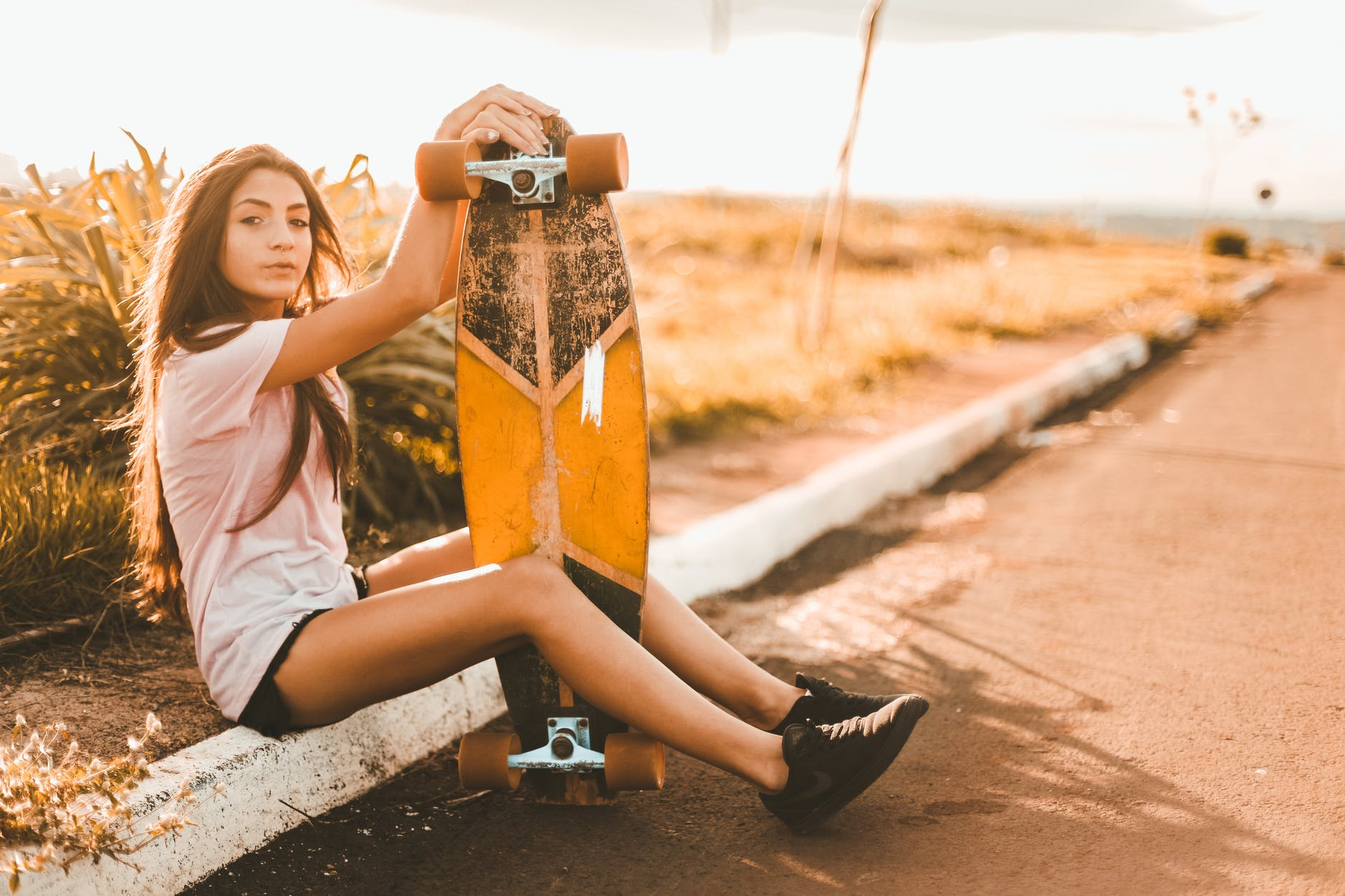 skater with her longboard and best grip tape